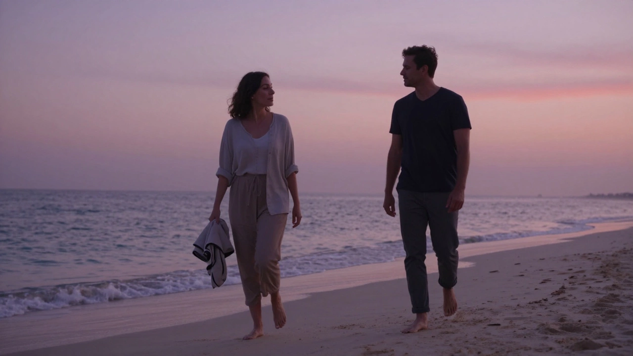 A woman and man walking barefoot on a Dubai beach at twilight, sharing a peaceful, unspoken bond.